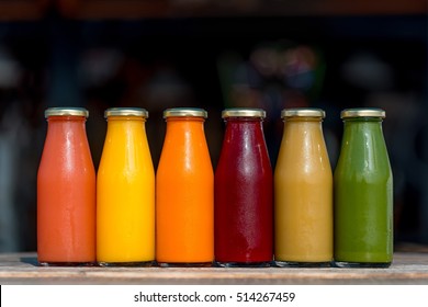 Raw vegetable and fruit juices in glass bottles