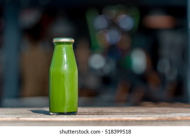 Raw vegetable juice in glass bottle