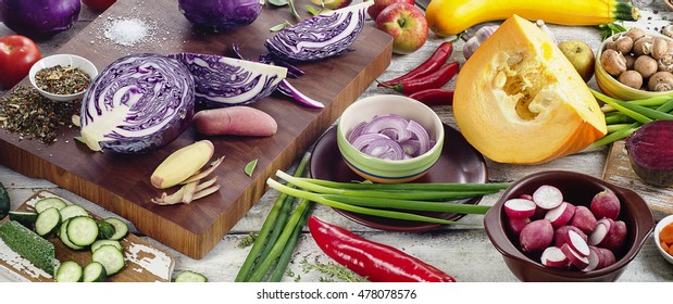 Raw vegetables on a wooden board. Healthy eating concept. Top view. Panorama