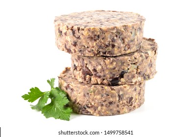 Raw Veggie Burger With Black Beans With Parsley Leaves On White Background.