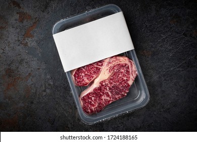 Raw Wagyu Marbled Beef Steak In Vacuum Packaging, Logo Mockup For Design