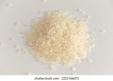 Raw White Rice Grains On White Table