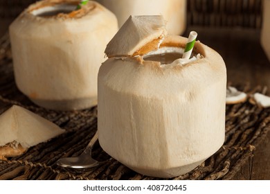 Raw White Young Coconut Drink with a Straw