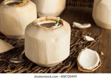 Raw White Young Coconut Drink with a Straw