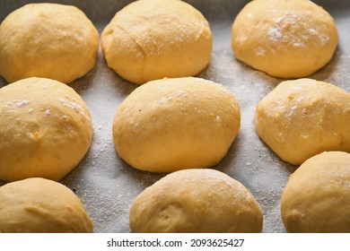 Raw Yeast Dough Balls Background In Frying Pan Before Baking. Concept Home Baking Bread, Buns Or Cinnabon Or Making Dough.