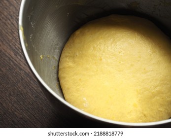 Raw Yellow Pumpkin Bread Dough In Mixing Bowl