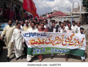 RAWALAKOT, PAKISTAN, SEPT 23: Supporters Of Jammu Kashmir Liberation Front Pass Through A Road During Protest Rally Against Terrorism On Thursday September 23, 2010 In Rawalakot, Pakistan.