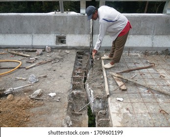 Rawang, Selangor. Feb 20 2019. Worker Is Rectifying The Surface Of Concrete For Construction Of Bridge Expansion Joint.