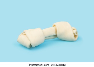 A Rawhide Bone On A Light Blue Background