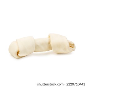 Rawhide Bone On A White Background With Copy Space