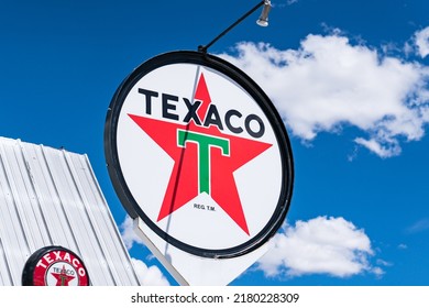 Rawlins, WY - June 2, 2022: Old Texaco gas station sign along the highway in Rawlins, Wyoming