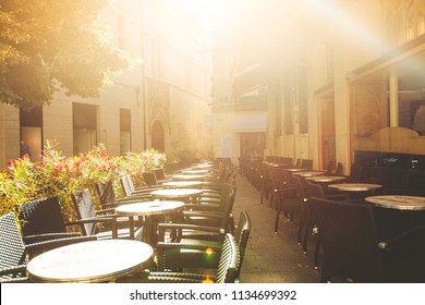 Raws Of Street Cafe Tables At Sunset In Avignon, France