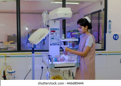 RAXAUL, INDIA - NOV 13: Unidentified Indian Nurse Working At A Neonatal Intensive Care Unit Of A Hospital On November 13, 2013 In Raxaul, Bihar, India. Bihar Is One Of The Poorest States In India.