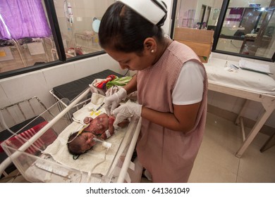 RAXAUL, INDIA - NOV 13: Unidentified Indian Nurse Working At The Neonatal Intensive Care Unit Of A Hospital On November 13, 2013 In Raxaul, Bihar, India.