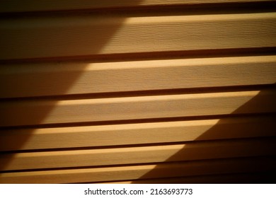 Ray Of Light On House Siding Texture Backdrop