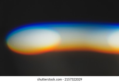 Ray of light with spectrum colors goes over white wall, refraction effect. Abstract photo
