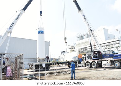 Rayong Province Thailand , Feb 28 , 2018 :  Unidentified Thai Man Working Move The Gas Co2 Tank Using A Crane.