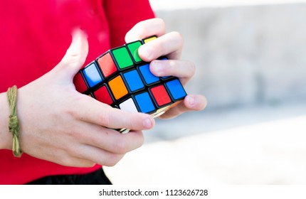 Rayong Province, Thailand - June 30th, 2018: Kids Hands Plaiyng With The Rubik's Cube. Rubik's Cube Invented By A Hungarian Architect Erno Rubik In 1974.;