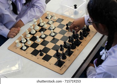 Rayong, Thailand - 8th September, 2017: Thai High School Girls Play A Game Of Chess In Class As Part Of A Club Activity, Rayong Province, Eastern Thailand.