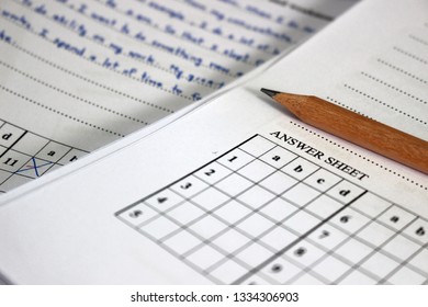 Rayong, Thailand - March 10th, 2019: A Blank Exam Paper Lies On Top Of A Student's Test Paper Already Marked By A Teacher At A School In Eastern Thailand.