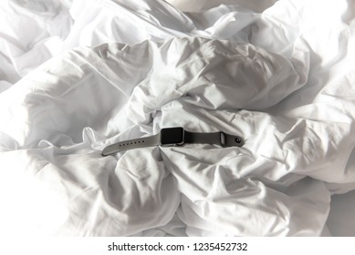 RAYONG, THAILAND - OCTOBER 21, 2018 : Apple Watch Black Screen On The Unmade White Bed At Samed Island, Rayong, Thailand.