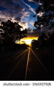 Rays Of Dying Light Shine Down The Tram Tracks In Melbourne Australia