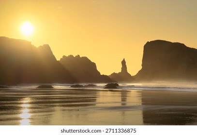 Rays of light appear during sunset on beach in Oregon