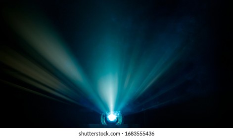 Rays Of Light Coming From A Digital Projector In A Theatre Room  