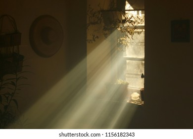 Rays Of Light Coming From A Window In An Old Country House. Heavenly Light In A Dusky Old House.