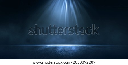 Rays light on blue wall with smoke. Empty scene, Dark asphalt with copy space. 