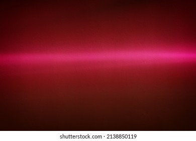 Rays of light on a painted wall background. Blurred abstract background light effect, light leaks. Side surface illumination. Parallel and asymmetric lines or stripes of light at an angle