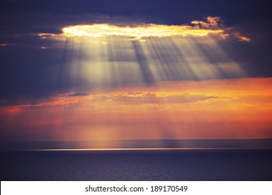 Rays Of Light Shine In Water, Dramatic Sunset