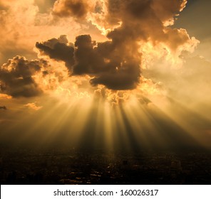 Rays Of Light Shining Through Dark Clouds For Background