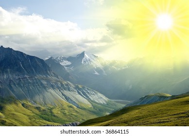 rays of sun above a mountains