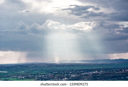 Rays Of The Sun Breaking Through The Clouds Over The Mirpur City And Mangla Dam