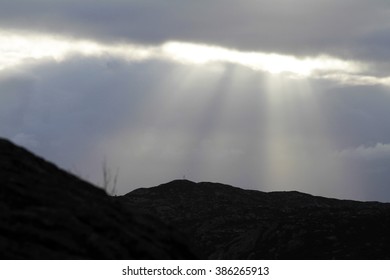 rays of sun breaking through clouds