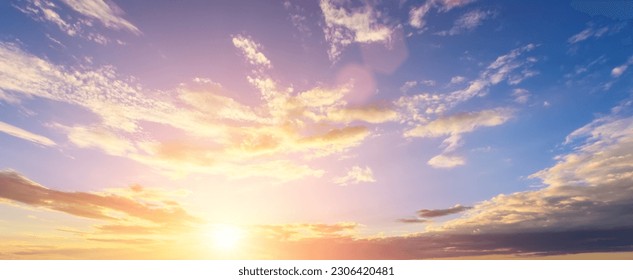 The rays of the sun breaking through the dramatic clouds in the evening or in the morning in the sunset or dawn sky. The concept of faith, hope for the best or good weather.