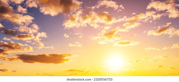The rays of the sun breaking through the dramatic clouds in the evening or in the morning in the sunset or dawn sky. The concept of faith, hope for the best or good weather.