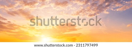The rays of the sun breaking through the dramatic clouds in the evening or in the morning in the sunset or dawn sky. The concept of faith, hope for the best or good weather.