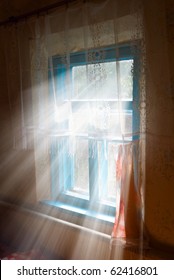 Rays Of Sun Pushing Through A Window