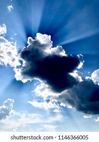 Rays of sun shining through the clouds