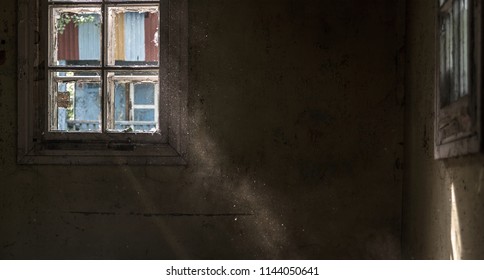 Rays Of The Sun Through An Old Window