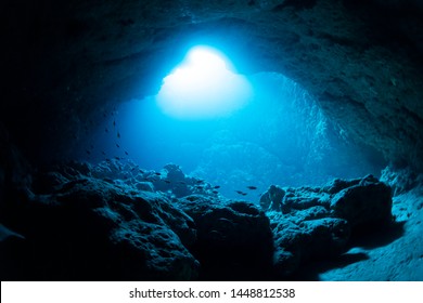 Rays of sunlight into the underwater cave - Shutterstock ID 1448812538