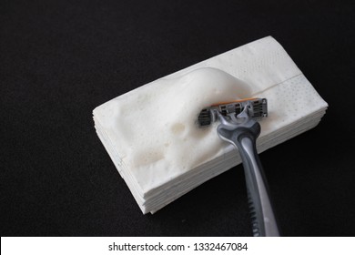 Razor Blade, Paper Tissue With Foam On A Black Background