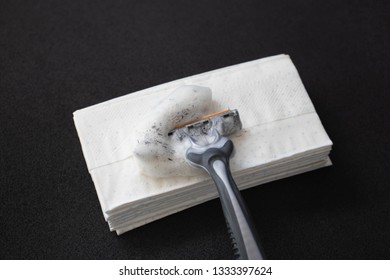 Razor Blade, Paper Tissue With Foam On A Black Background