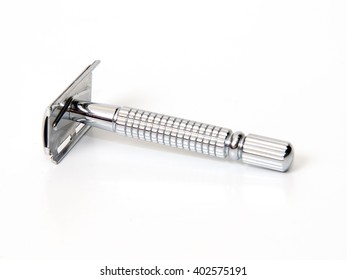 Razor And Shaving Brush On A White Background