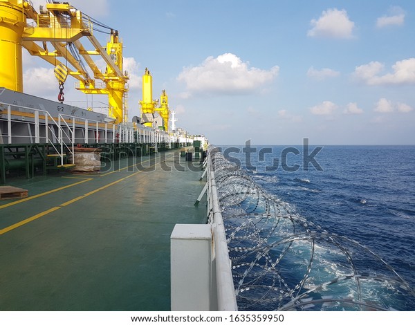 razor wire fitted on ship side\
during passing high risk area to prevent and avoid piracy\
attack.