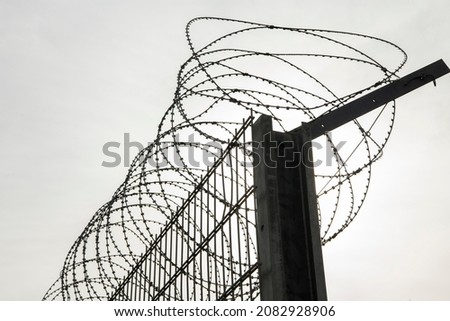 A razor wire on the border between two countries