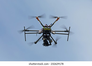 RC helicopter (multicopter or drone) with a camera in the sky