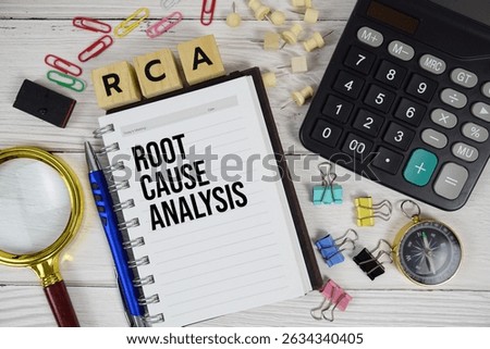 RCA - Root Cause Analysis acronym on notepad, business and financial concept background
